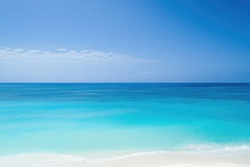 Obraz premium Tranquil Turquoise Ocean and Pristine White Sandy Beach Under a Clear Blue Sky