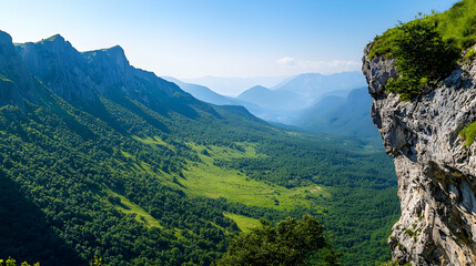 Obraz premium Panoramic View Of Valley Surrounded By Lush Green Mountains
