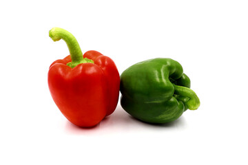Red and green bell pepper isolated on a white background.