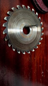 A circular saw blade on a wooden surface