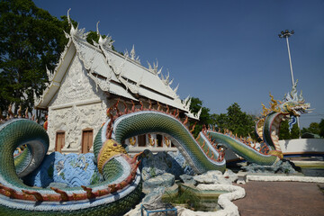 Wat Nong Jab Tao is a temple with a beautiful white ordination hall. It stands out with its beautiful stucco art of Naga sculptures in the surrounding area. Located at Chon Buri Province in Thailand.