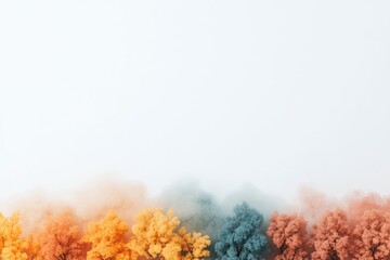 Fototapeta premium Abstract autumn trees row colorful pastel haze background scenic