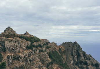 big volcanic mountains on cloudy day on island