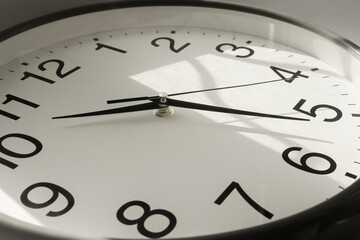 Clock With Second, Minute and Hour Hands With Sun Flare Reflection During the Day. Modern Wall Clock Show the Running Time