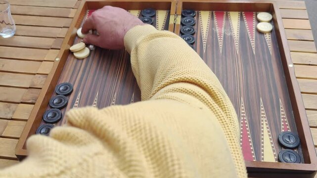 Two Men Playing a Traditional Game of Backgammon Footage.