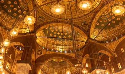 Display the Cairo citadel illumination in Mohammed Ali Mosque interior, showcasing alabaster art....
