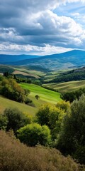 Obraz premium A beautiful landscape with a cloudy sky and mountains in the background. The trees are green and the hills are covered in grass