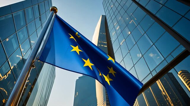 European Union flag flying high in front of modern skyscrapers, symbolizing the EU amidst urban cityscape and clear skies.

