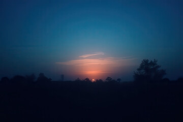 Moody After-Sunset Abstract Scene: Fading Blue Sky, Soft Glow Horizon, Quiet Silhouettes