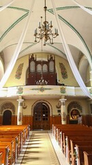 Shot of the interior of the church in Zalipie village with colorful floral decorations