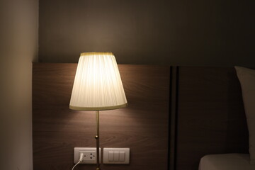 Turn on the bedside lamp in the bedroom. the lamps in the hotel room to relax and sleep.