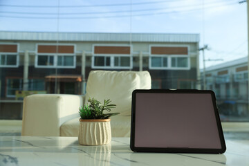 Digital tablet at home, Close-up of Technology in use.Sun Room Interior Design
