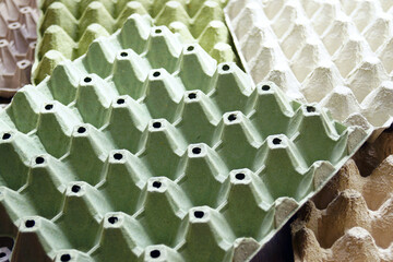 Eco-friendly packaging on a farm: colorful cardboard packaging for storing and transporting chicken...