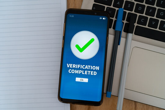 Biometric verification completed successfully on smartphone app. Concept of cyber security and KYC.