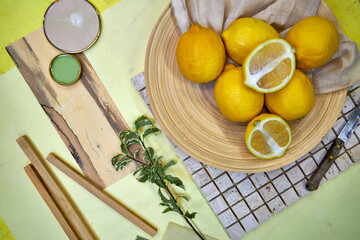 Color palette mood board in yellow tones with lemons and floral decoration