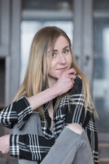 Fototapeta premium Confident Female with Long Hair in Black and White Shirt Indoors