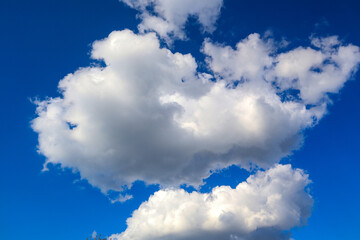 Light white airy clouds in the blue sky on a summer day