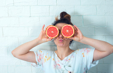 red grapefruit in woman eyes