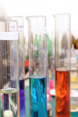 Row of test tubes with colorful liquids