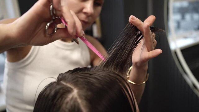 Professional haircutting techniques showcasing precision trimming and styling with scissors and comb