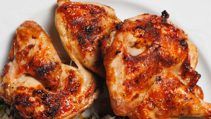 Appetizing chicken thighs with golden crust close-up