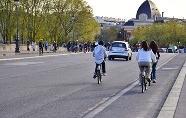  Cyclists on the roads of Paris.