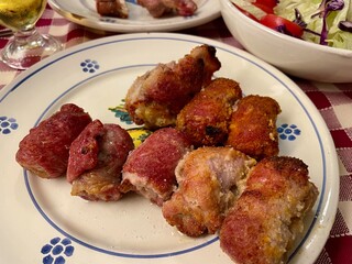 Bombette Pugliesi - fresh pork meat rolls stuffed with cheese, pancetta, salt and pepper, cooked in traditional fornelli oven.