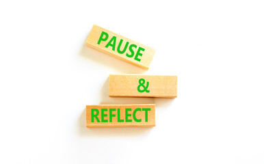 Pause and reflect symbol. Concept words Pause and reflect on beautiful block. Beautiful white table...