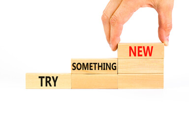Try something new symbol. Concept words Try something new on beautiful block. Businessman's hand....