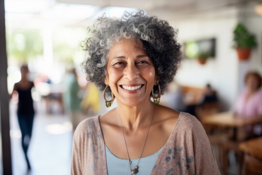 Smiling portrait of a happy senior Latin or Mexican woman in a nursing home
