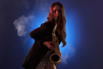 Obraz premium Professional musician playing saxophone on color background with smoke