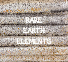 Rare earth elements symbol. Concept words Rare earth elements on beautiful grey stone wall. Beautiful grey mountain stone wall background. Business and rare earth elements concept. Copy space.
