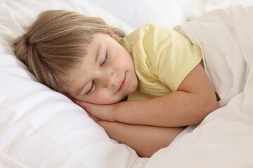 Bedtime. Cute little girl sleeping in bed