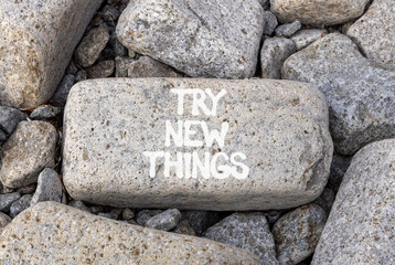 Try new things symbol. Concept words Try new things on beautiful grey stone. Beautiful grey mountain stone background. Business motivational lifestyle try new things concept. Copy space.