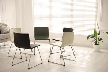 Chairs in circle prepared for group psychotherapy session indoors