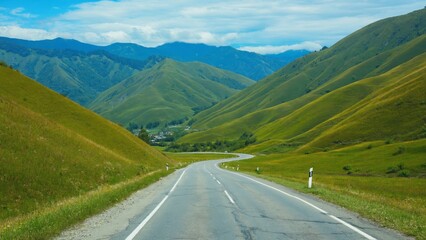 Fototapeta premium Winding asphalt highway on mountainous terrain.