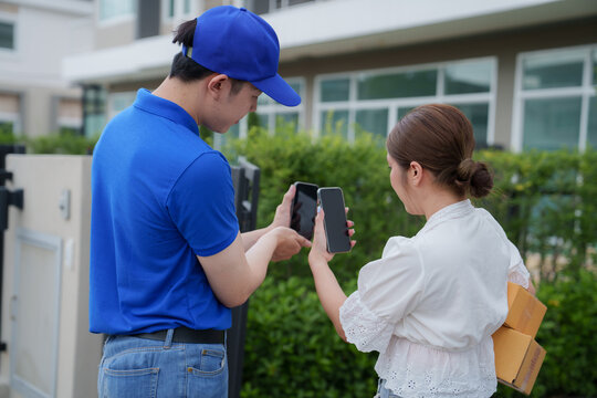 Asian customer young woman using mobile smartphone with QR code payment to receive parcel post box from delivery man, Hands of female scanning at door front house, Online shopping service concepts
