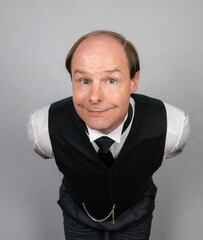 Smiling Butler in Formal Attire Eager to Be of Service. Professional Hospitality and Cheerful Courtesy.