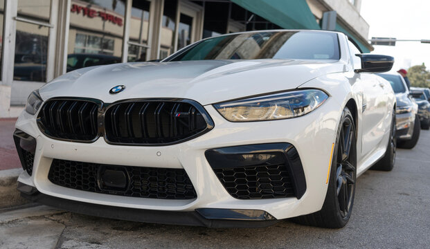 Miami, Florida, USA - December 15, 2024: white 2024 BMW M8 Competition car. Luxury car of BMW M8 Competition model. Car of BMW M8 parked outdoor. BMW M8, front view.