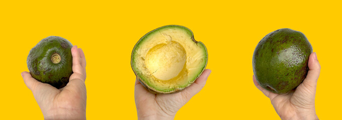 Hand holding half avocado, fresh fruit, healthy eating, green and yellow texture, natural...