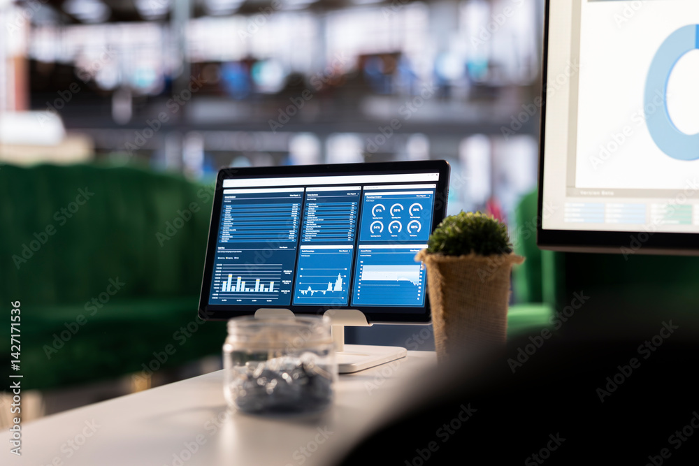 Poster executive workspace features a digital dashboard with financial charts and reports. this setup empha