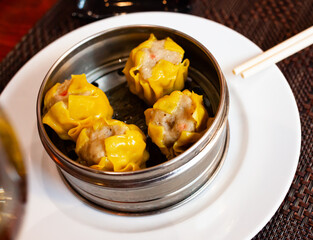 Chinese dumpling shumai on a white plate