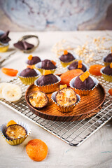 Artisan homemade pralines with dried apricots, fruits and nuts,  coated with fine bitter dark chocolate