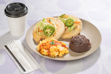 Delicious Salvadoran breakfast that includes: Refried beans, scrambled eggs, 