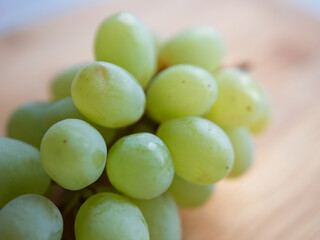 Fresh Green Grapes on a Wooden Surface for Healthy Snacking