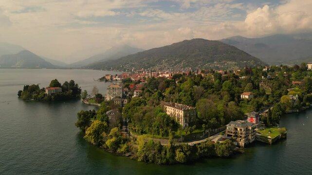 Aerial view of Lake Como, Italy. Beautiful lake surrounded by Alps mountains, charming towns, and green landscapes. Scenic nature and travel destination in Europe