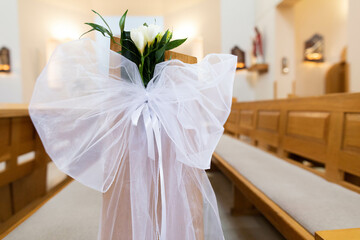 Elegant Wedding Decoration Featuring Beautiful White Flowers in a Charming Church Setting