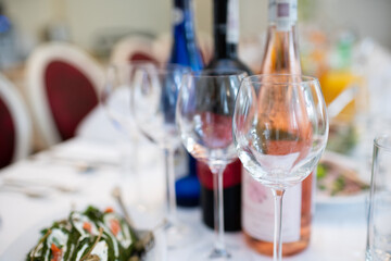 An Elegant Dining Setup Complete with Wine Bottles and Glasses for a Memorable Occasion