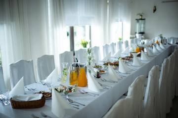 An Elegant Long Dining Table Set ideal for a wonderful Celebration or memorable Gathering