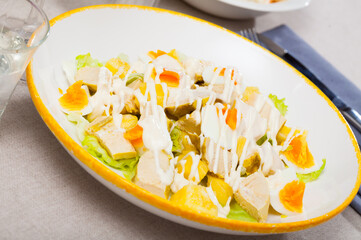 Salad with chicken, egg and pineapple